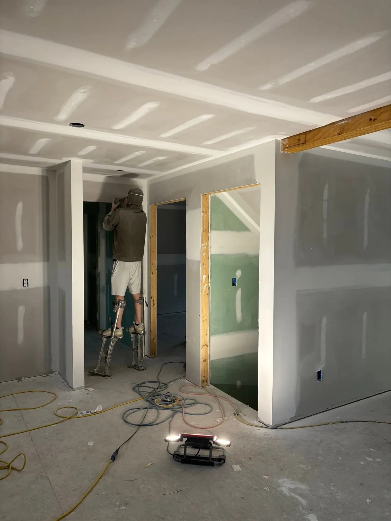 Drywall finisher working on interior corner