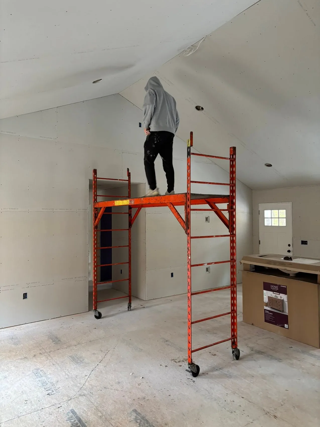 Drywall installation using rolling scaffold